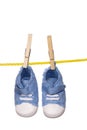 Baby shoes hanging on a clothesline Royalty Free Stock Photo