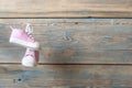 Baby shoes hanging on the clothesline. Royalty Free Stock Photo