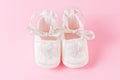 Baby shoes on pink background Royalty Free Stock Photo