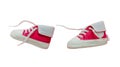 Baby shoes red pink color isolated cutout flying on white color background Royalty Free Stock Photo