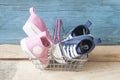 Baby shoes and shopping basket Royalty Free Stock Photo