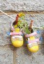 Baby shoes. Summer. Yellow flowers. Royalty Free Stock Photo