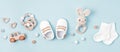 Baby shoes and teethers banner. Organic newborn accessories, branding, small business idea. Royalty Free Stock Photo