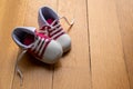 Baby shoes on wood, closeup view, copy space Royalty Free Stock Photo