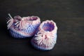 Baby shoes wooden table Royalty Free Stock Photo