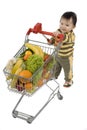 Baby with shopping cart Royalty Free Stock Photo