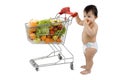 Baby with shopping cart Royalty Free Stock Photo