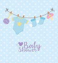 Baby shower, blue hanging clothes pacifier dotted background card Royalty Free Stock Photo