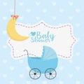 Baby shower, blue pram and hanging moon decoration