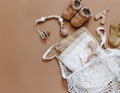 Baby shower concept. Newborn baby accessories on brown background,