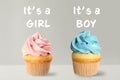 Baby shower cupcakes for boy and girl on background Royalty Free Stock Photo