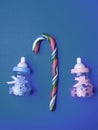 Baby Shower greeting card with babies boy and girl toy bottles and candy cane, baby announcement card design element Royalty Free Stock Photo