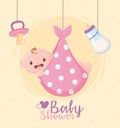 Baby shower, greeting card hanging little boy pacifier and bottle milk Royalty Free Stock Photo