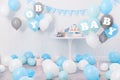 Baby shower party for boy. Treats in room decorated with balloons Royalty Free Stock Photo