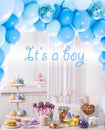 Baby shower party for boy. Tasty treats on table in room with balloons Royalty Free Stock Photo