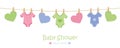 Baby shower welcome greeting card for childbirth with hanging hearts and bodysuits Royalty Free Stock Photo