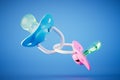 Baby silicone pacifiers for twins on a blue background. 3D render