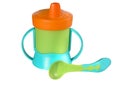 Baby sippy and spoon Royalty Free Stock Photo