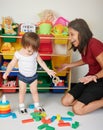 Baby sitter playing with kid Royalty Free Stock Photo