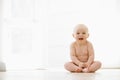 Baby sitting indoors smiling Royalty Free Stock Photo