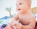 Baby sitting in little pool on the sea beach