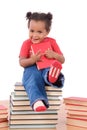 Baby sitting on a pile of books