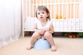 Baby sitting on potty in home Royalty Free Stock Photo