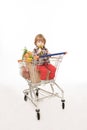 Baby sitting in shopping cart
