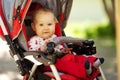 Baby in sitting stroller