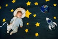 baby sleep of an astronaut in space with stars