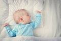 Baby sleeping on blue blanket Royalty Free Stock Photo