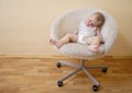 Baby sleeping on chair