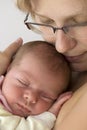 Baby sleeping in mothers arm Royalty Free Stock Photo
