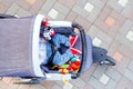 Baby sleeping three-wheel stroller outdoor. Child in bright casual costume lying at big comfortable pram. Parent walking with carr