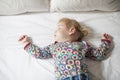 Baby sleeping on white bed Royalty Free Stock Photo