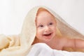 Baby, smile or towel to play, relax or laugh in nursery at bath time in studio on white background. Happy, young child Royalty Free Stock Photo