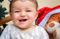 baby smiles. the first teeth stick out. Christmas Royalty Free Stock Photo