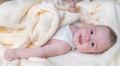 Baby is smiling and lying down. Child care concept Royalty Free Stock Photo