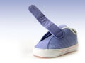 Blue baby shoe with open velcro strap, isolated, clipping path included.