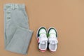 Baby sneakers and jeans pants. Set of children`s clothes and accessories for spring, autumn or summer. Fashion kids outfit, Royalty Free Stock Photo