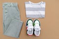 Baby sneakers,t shirt and jeans pants. Set of children`s clothes and accessories for spring, autumn or summer. Fashion kids outfi Royalty Free Stock Photo