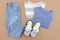 Baby sneakers,t shirt and jeans pants. Set of children`s clothes and accessories for spring, autumn or summer. Fashion kids outfi Royalty Free Stock Photo