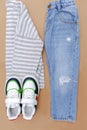 Baby sneakers,t shirt,jumper and jeans pants.Set of children`s clothes and accessories for spring, autumn or summer.Fashion kids Royalty Free Stock Photo