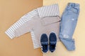 Baby sneakers,t shirt,jumper and jeans pants.Set of children& x27;s clothes and accessories for spring, autumn or summer Royalty Free Stock Photo