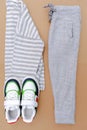 Baby sneakers,t shirt,jumper and jeans pants.Set of children& x27;s clothes and accessories for spring, autumn or summer Royalty Free Stock Photo