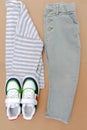 Baby sneakers,t shirt,jumper and jeans pants.Set of children& x27;s clothes and accessories for spring, autumn or summer Royalty Free Stock Photo