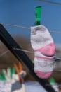 Baby sock hung with clothespins