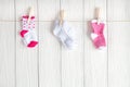 Baby socks on rope at wooden background Royalty Free Stock Photo