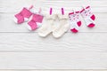 Baby socks on rope at wooden background Royalty Free Stock Photo