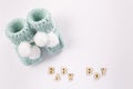 Baby socks on white background. Baby boy birth. Greeting card idea for newborn.Pregnancy announcement. Flatlay, top view